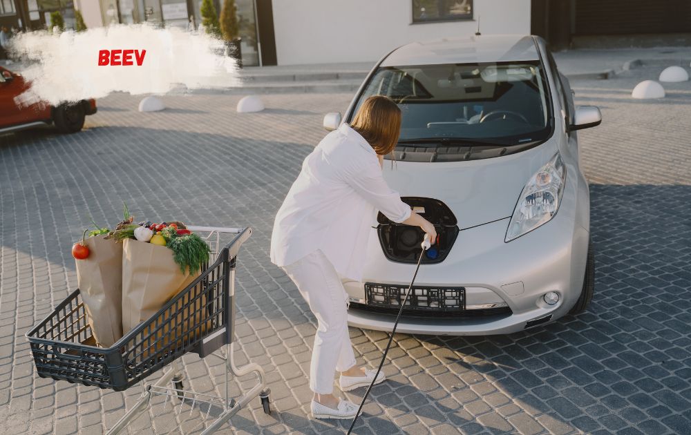Electric car charging at a Beev charging hub with ultra-rapid bays