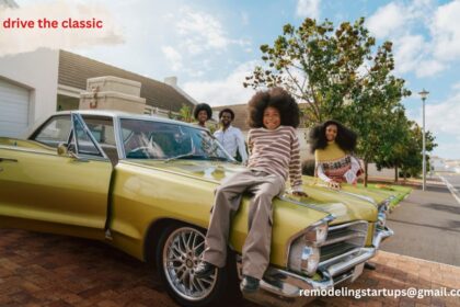 A family drive the classic car on an open road