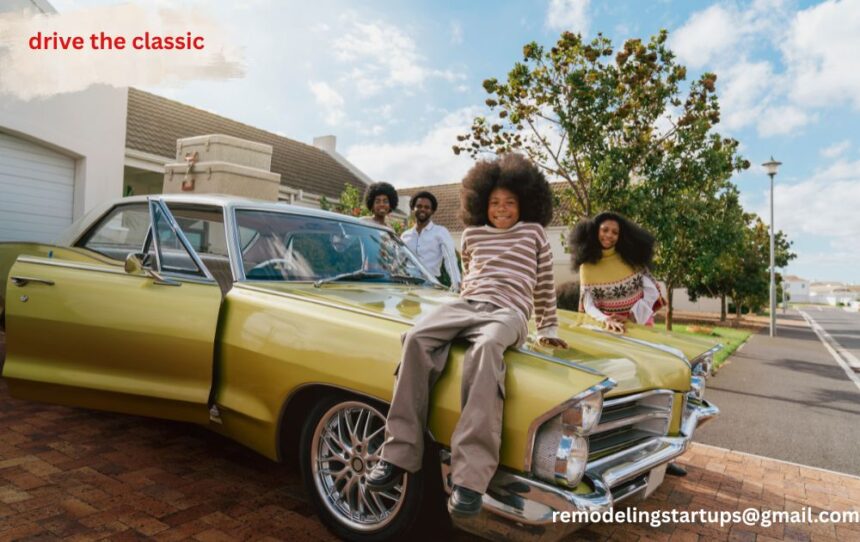 A family drive the classic car on an open road