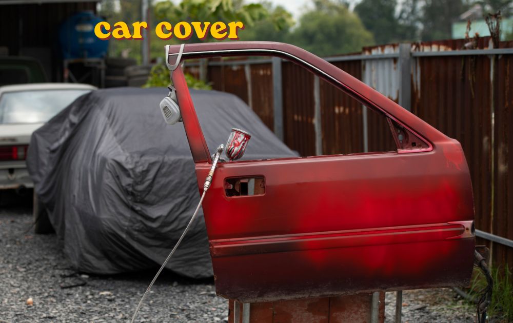 Car cover fitted over a parked vehicle for weather protection