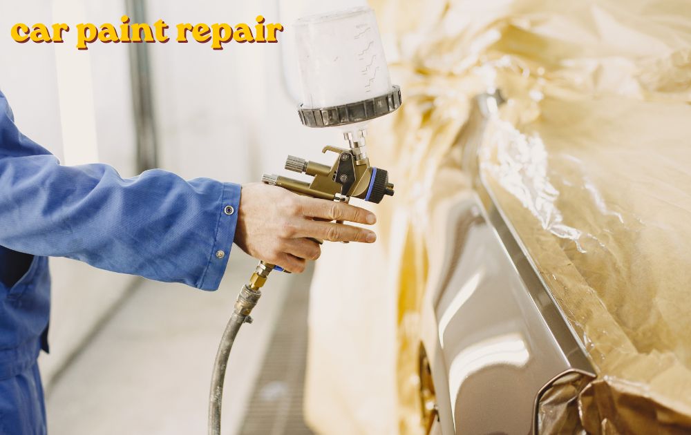 Car paint repair being done on a scratched vehicle door panel