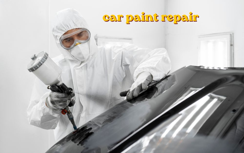 Car paint repair being done on a scratched vehicle door panel