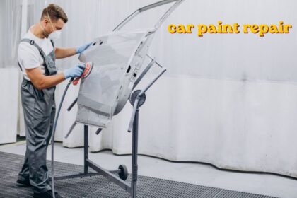 Car paint repair being done on a scratched vehicle door panel