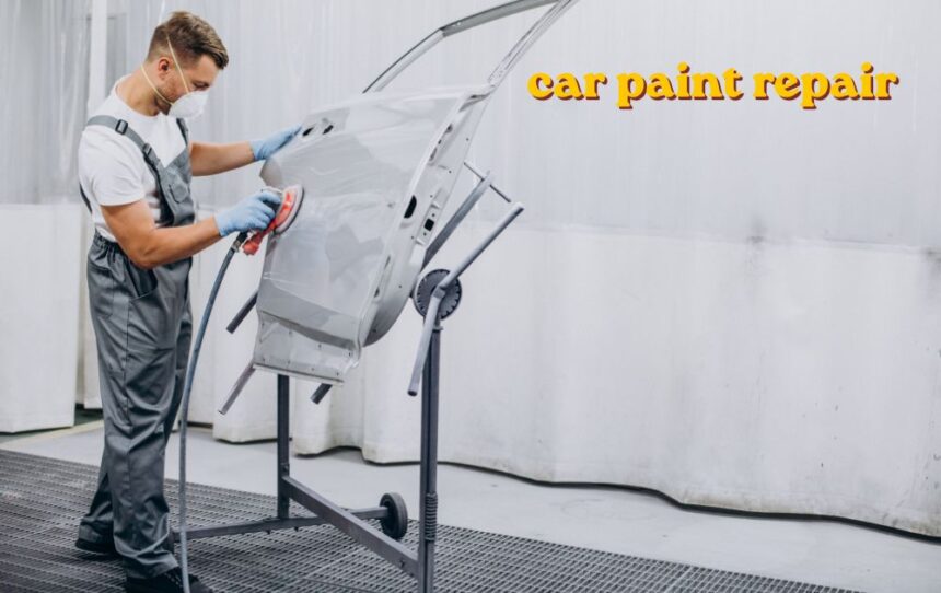 Car paint repair being done on a scratched vehicle door panel
