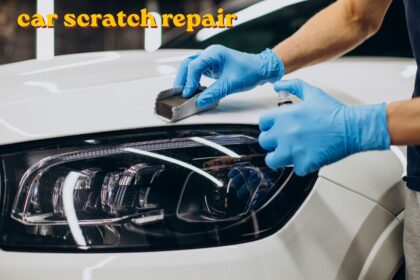 Car scratch repair being done on a vehicle door panel with touch-up paint