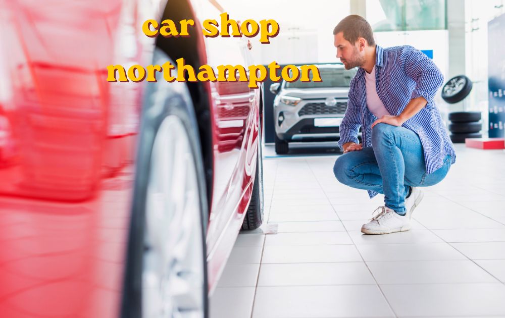 Mechanic working on a car engine inside a car shop Northampton garage
