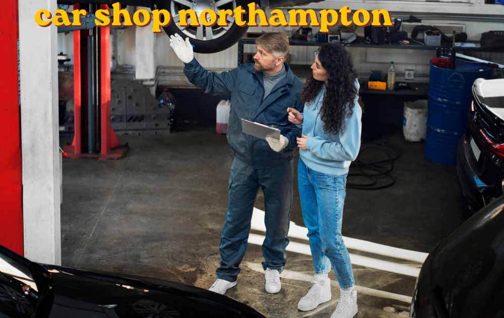 Mechanic working on a car engine inside a car shop Northampton garage