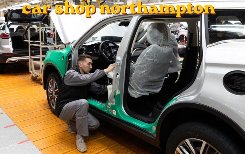 Mechanic working on a car engine inside a car shop Northampton garage
