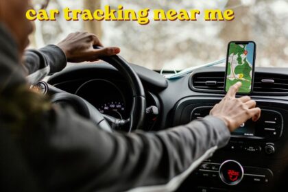 Mechanic checking car tracking near me wheel alignment on a vehicle in a garage