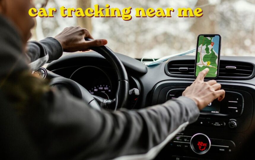 Mechanic checking car tracking near me wheel alignment on a vehicle in a garage