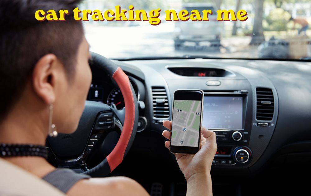 Mechanic checking car tracking near me wheel alignment on a vehicle in a garage