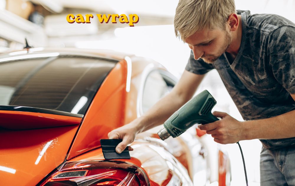 Car wrap installation on vehicle showing vinyl film application process