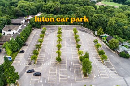 Rows of parked vehicles at a Luton car park near the airport terminal
