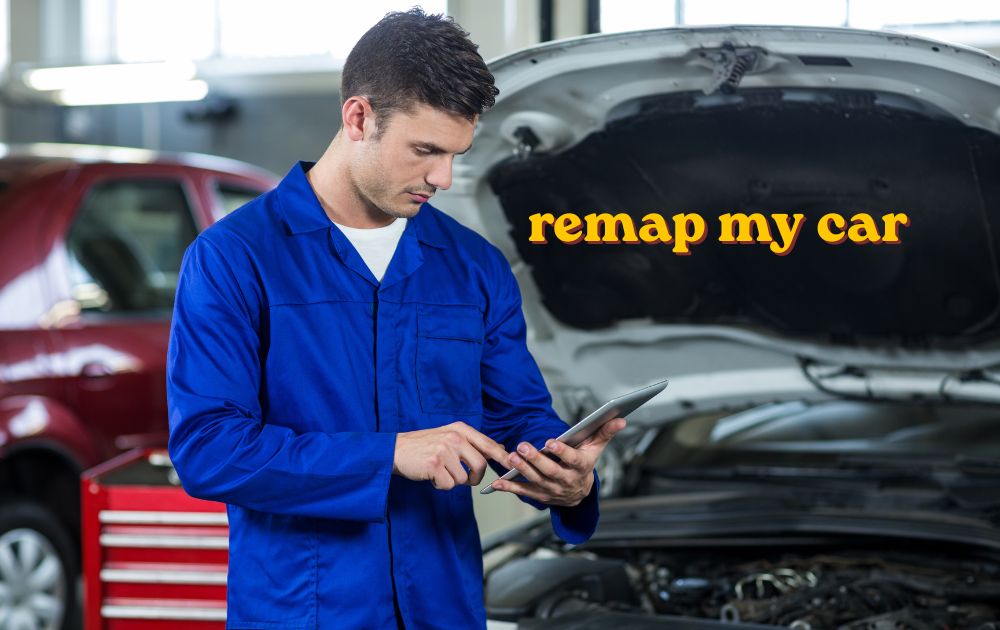 Mechanic using a laptop to remap my car through the OBD port under the dashboard