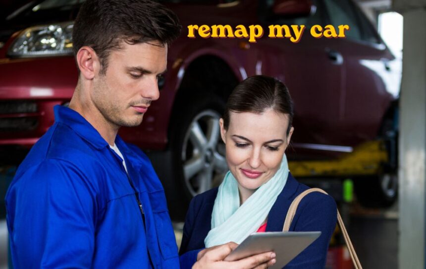 Mechanic using a laptop to remap my car through the OBD port under the dashboard