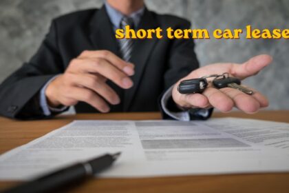 A person signing a short term car lease agreement at a dealership with a modern car in the background