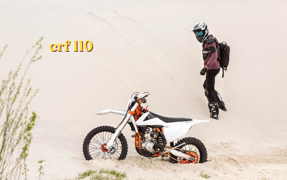 Honda CRF 110 off-road motorcycle parked on dirt trail