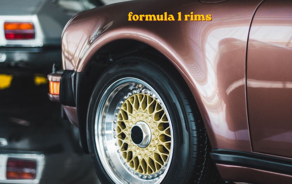 Formula 1 rims on display stand with slick racing tyre and carbon wheel cover