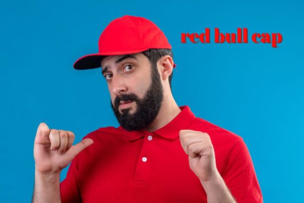 red bull cap with embroidered logo and curved visor on display