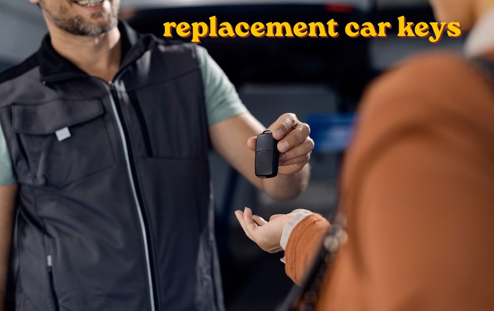 Replacement car keys and remote fobs laid out on a table beside a car