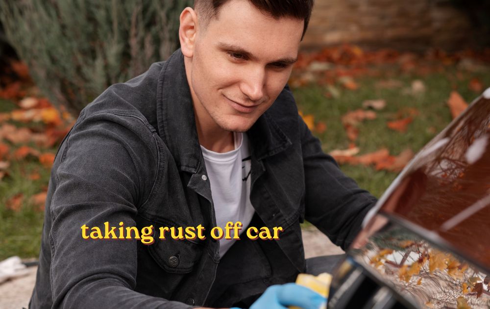 taking rust off car door panel with sandpaper and rust remover in a home garage