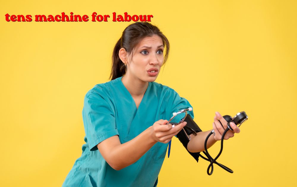 tens machine for labour device attached to lower back for pain relief