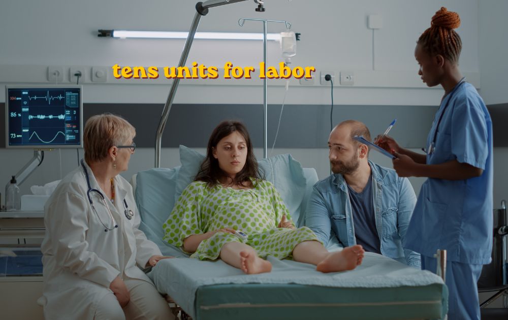 Pregnant woman using tens units for labor with electrode pads on lower back